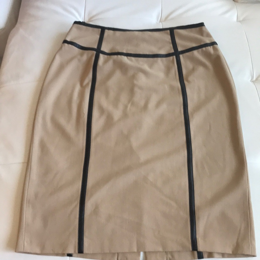 Skirt little worn at top tan trimmed with black